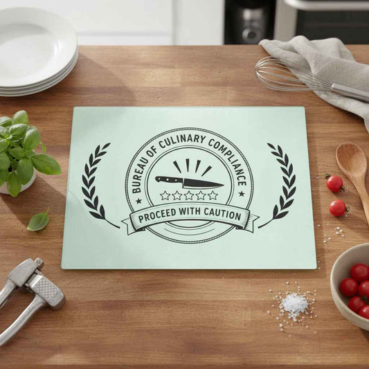 Bureau of Culinary Compliance Cutting Board – “Proceed With Caution” Glass Board