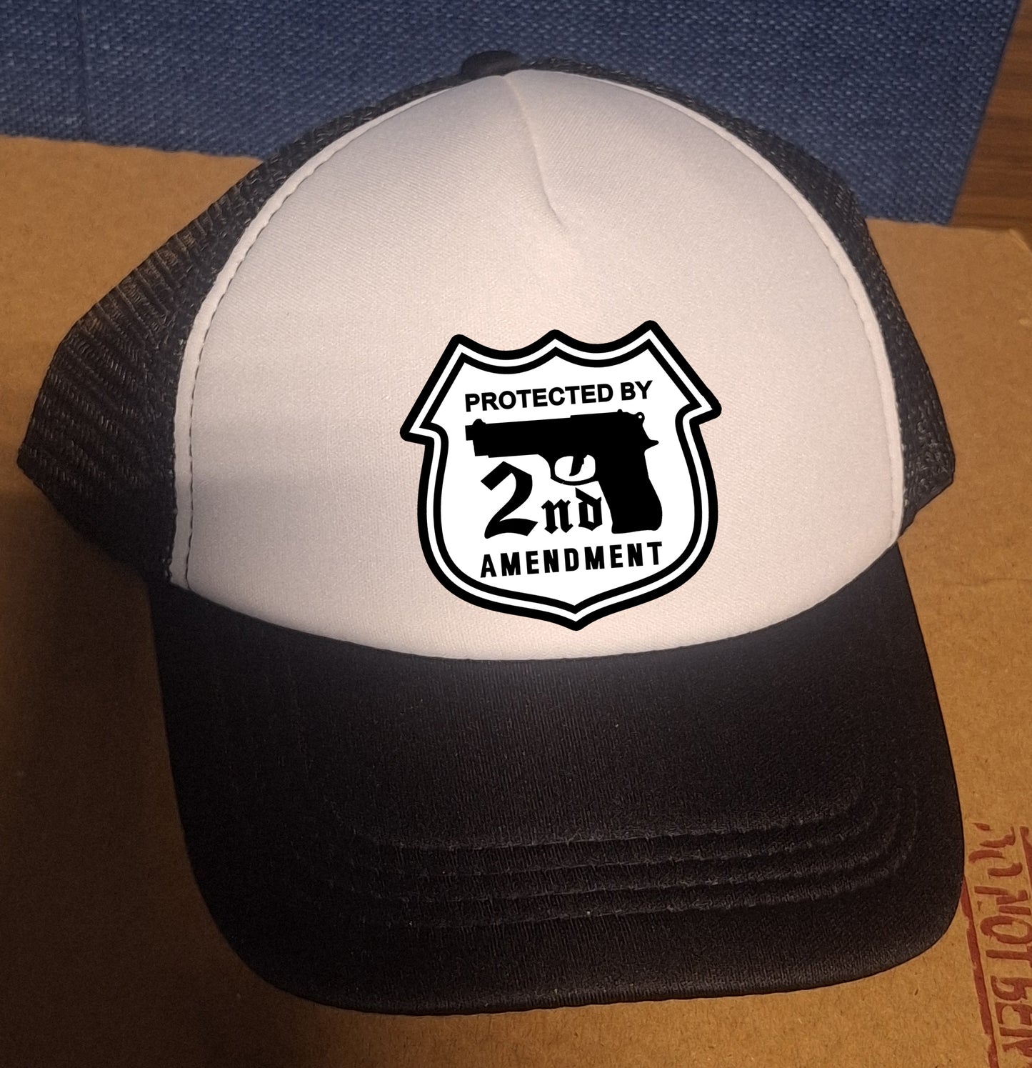 Adjustable Trucker Baseball Cap with Bold Second Amendment Protection Design