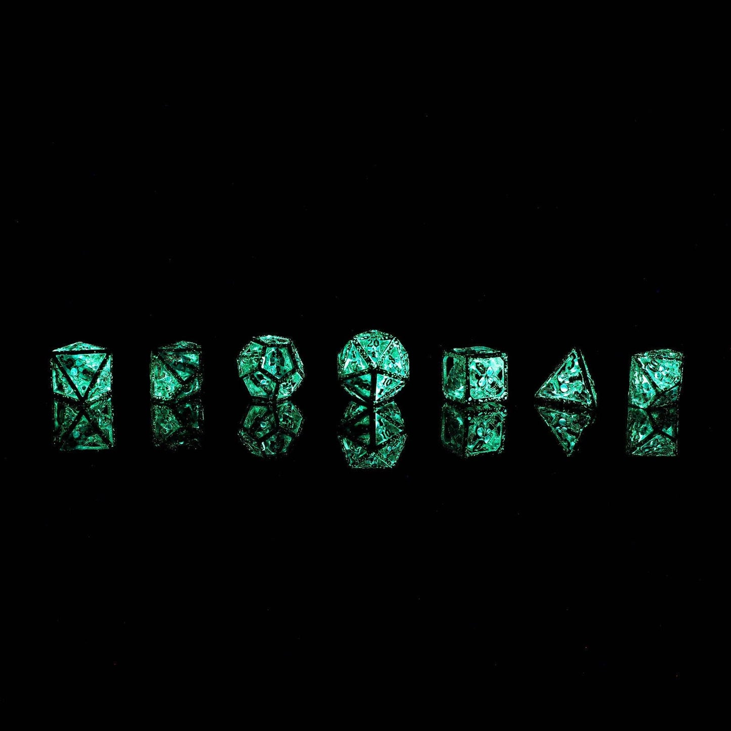 Skull's Grin Hollow Metal Dice Set - Glow in the Dark Blue
