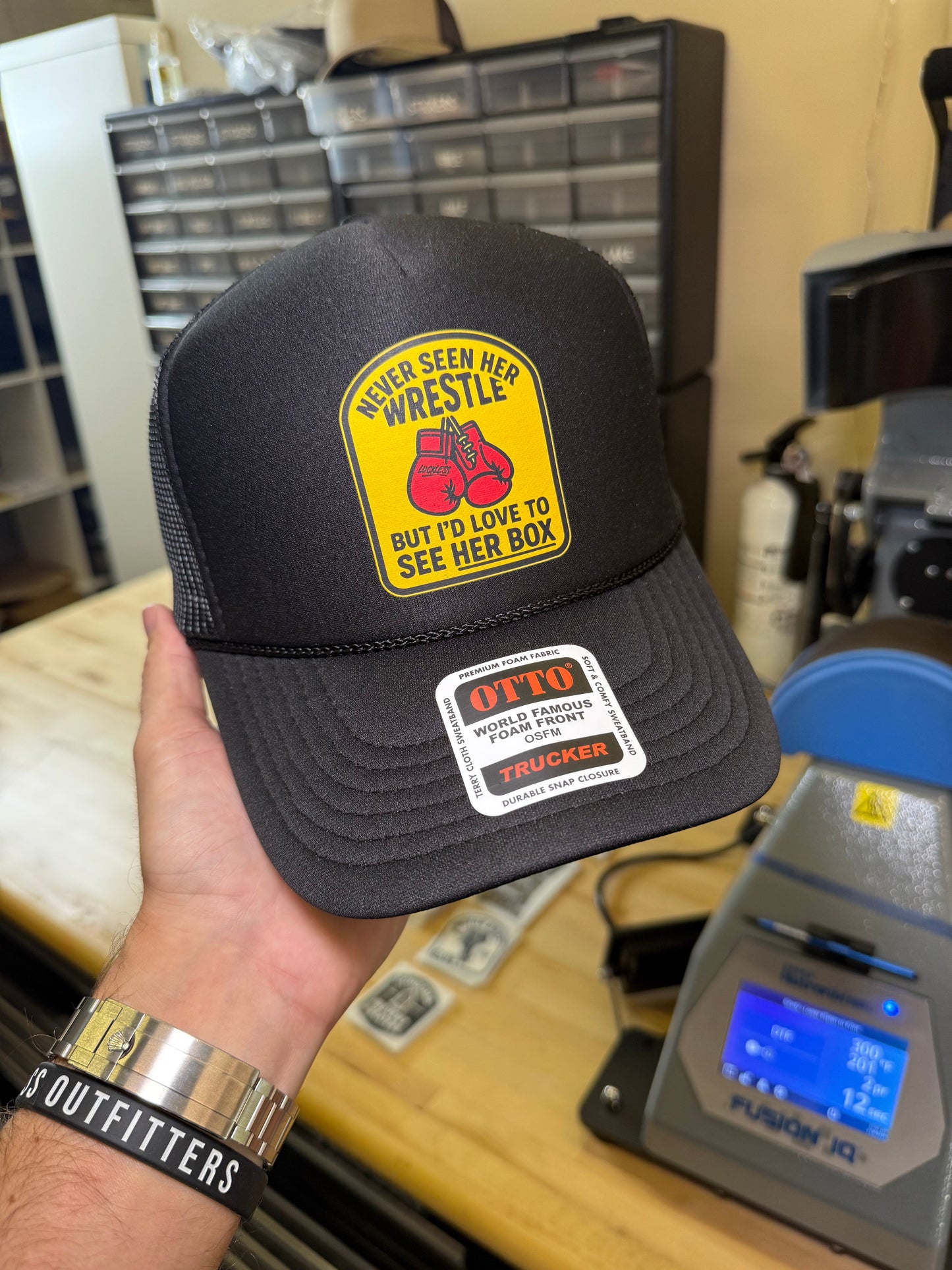 Love To See Her Box Trucker Hat by Luckless Outfitters